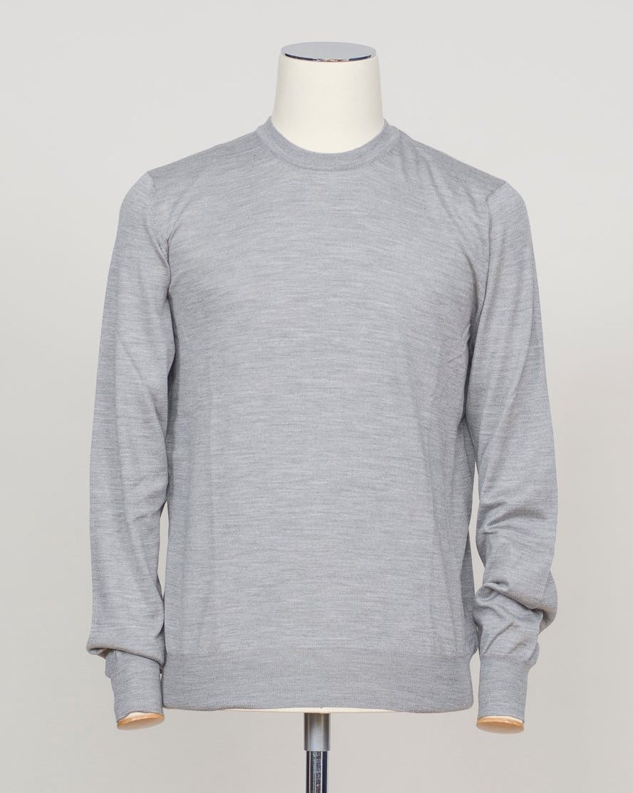 Refined Italian knitwear blending wool, cashmere, and silk for luxurious softness and breathability. The silver tone offers versatility across formal and casual occasions. Finely crafted construction ensures lasting wear and elegant drape. Gran Sasso Wool Cashmere & Silk Knit / Silver