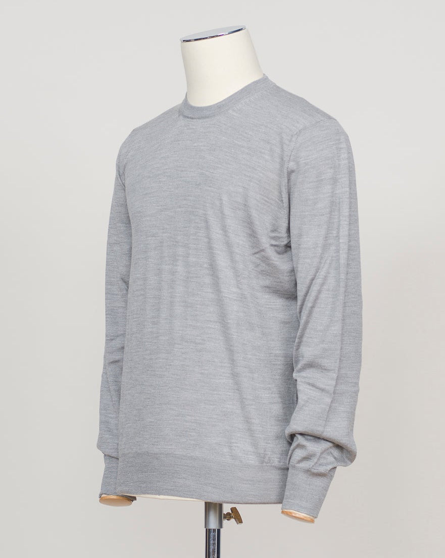 Refined Italian knitwear blending wool, cashmere, and silk for luxurious softness and breathability. The silver tone offers versatility across formal and casual occasions. Finely crafted construction ensures lasting wear and elegant drape. Gran Sasso Wool Cashmere & Silk Knit / Silver