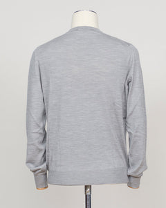 Refined Italian knitwear blending wool, cashmere, and silk for luxurious softness and breathability. The silver tone offers versatility across formal and casual occasions. Finely crafted construction ensures lasting wear and elegant drape. Gran Sasso Wool Cashmere &amp; Silk Knit / Silver