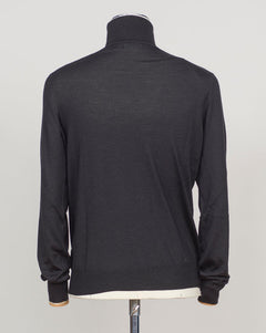 Luxurious roll neck in a refined blend of wool, cashmere and silk. The dark brown hue pairs effortlessly with tailored trousers and formal wear. Gran Sasso's Italian craftsmanship ensures a sumptuous drape and enduring comfort. A timeless layering essential for the discerning wardrobe. &nbsp;Gran Sasso Wool Cashmere &amp; Silk Roll Neck / Black