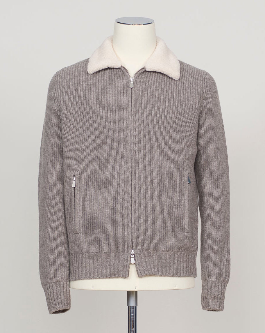 Luxurious full-zip knit in soft taupe with signature teddy collar detail. Gran Sasso's refined construction delivers comfort and timeless elegance. Perfect layering piece for the discerning wardrobe. Gran Sasso Teddy Collar Full-Zip Knit / Taupe