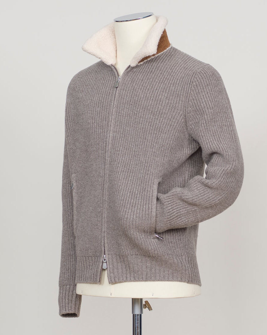 Luxurious full-zip knit in soft taupe with signature teddy collar detail. Gran Sasso's refined construction delivers comfort and timeless elegance. Perfect layering piece for the discerning wardrobe. Gran Sasso Teddy Collar Full-Zip Knit / Taupe