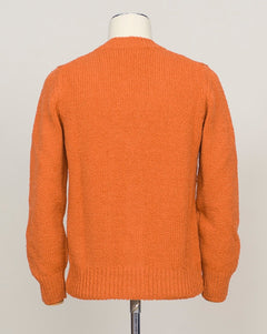 Italian heritage knitwear crafted from pure boiled wool. This cardigan combines warmth with refined simplicity—a versatile layer for any season. Button front, classic fit. Vibrant orange tone adds character to neutral wardrobes. Gran Sasso Boiled Wool Cardigan / Orange