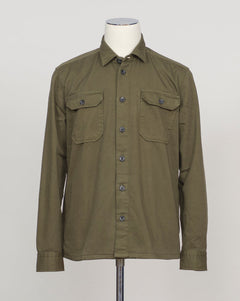 Heavy twill overshirt in rich dark olive. Crafted from substantial cotton twill for durability and structure. Classic overshirt silhouette layers effortlessly over knitwear or worn standalone. Designed for refined casual wear and everyday versatility. Ghirardelli Heavy Twill Overshirt / Dark Olive