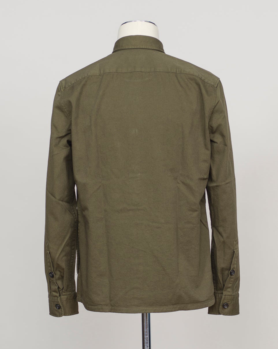 An olive green utility jacket shown from the back on a mannequin torso against a light gray background. Heavy twill overshirt in rich dark olive. Crafted from substantial cotton twill for durability and structure. Classic overshirt silhouette layers effortlessly over knitwear or worn standalone. Designed for refined casual wear and everyday versatility. Ghirardelli Heavy Twill Overshirt / Dark Olive