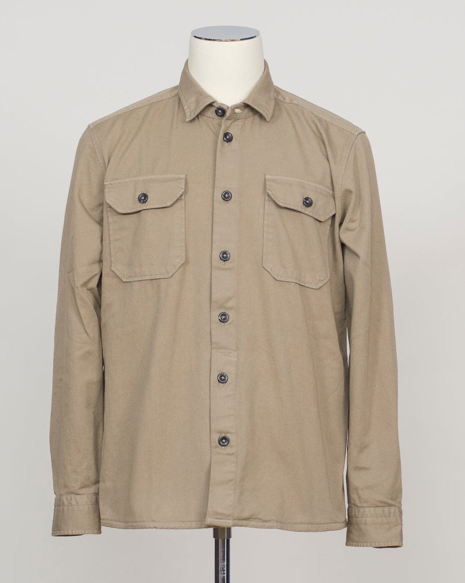 Ghirardelli Heavy Twill Overshirt / Taupe Heavy twill overshirt in taupe. Crafted from substantial cotton twill for durability and structure. Classic overshirt silhouette layers effortlessly over knitwear or worn standalone. Designed for refined casual wear and everyday versatility.&nbsp;