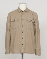 Ghirardelli Heavy Twill Overshirt / Taupe Heavy twill overshirt in taupe. Crafted from substantial cotton twill for durability and structure. Classic overshirt silhouette layers effortlessly over knitwear or worn standalone. Designed for refined casual wear and everyday versatility.&nbsp;