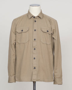 Ghirardelli Heavy Twill Overshirt / Taupe Heavy twill overshirt in taupe. Crafted from substantial cotton twill for durability and structure. Classic overshirt silhouette layers effortlessly over knitwear or worn standalone. Designed for refined casual wear and everyday versatility.&nbsp;