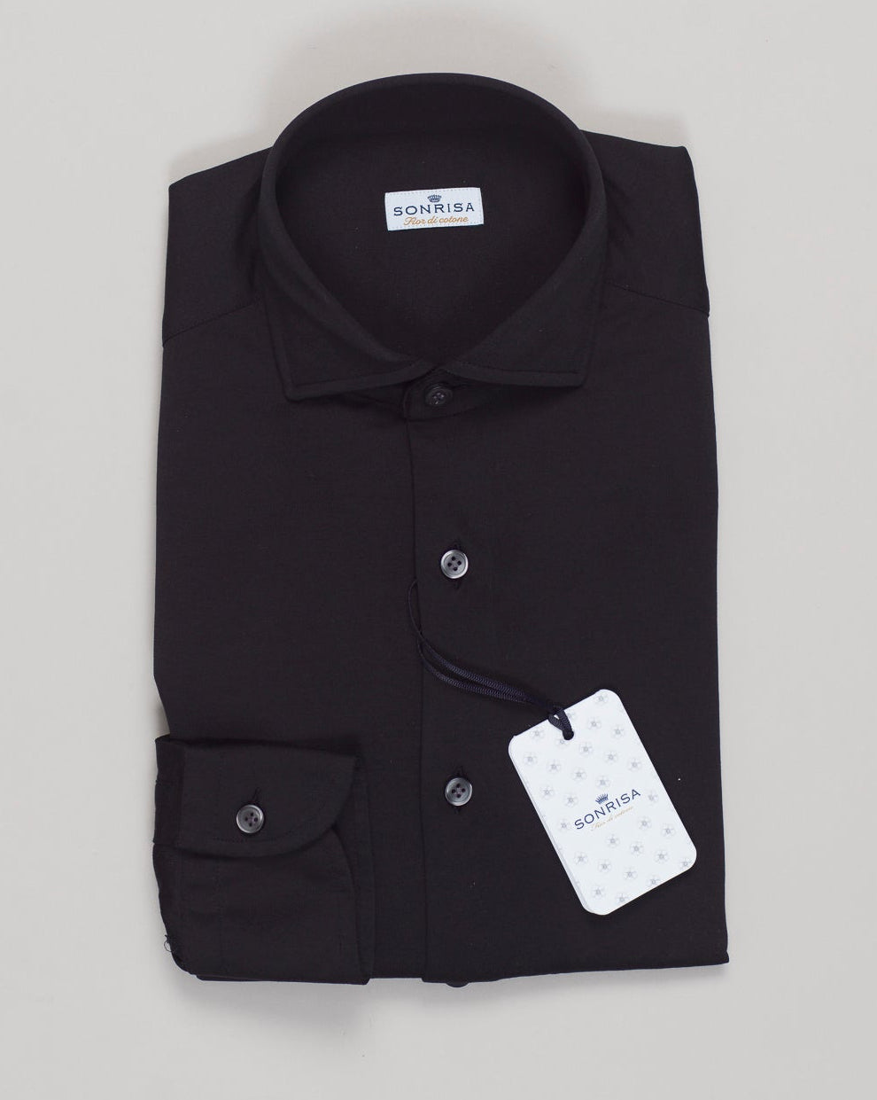 A timeless cotton jersey shirt crafted for everyday versatility. The Sonrisa features a soft, breathable cotton construction that moves with you through the day. Designed for comfort without compromise, this piece anchors any wardrobe with quiet luxury and understated elegance. Sonrisa Cotton Jersey Shirt / Black