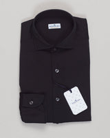 A timeless cotton jersey shirt crafted for everyday versatility. The Sonrisa features a soft, breathable cotton construction that moves with you through the day. Designed for comfort without compromise, this piece anchors any wardrobe with quiet luxury and understated elegance. Sonrisa Cotton Jersey Shirt / Black