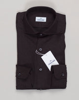Crafted from pure merino wool, this flannel shirt from Alessandro Gherardi delivers refined warmth with natural breathability. The dark brown tone pairs effortlessly with tailored trousers or casual knitwear, anchoring a versatile wardrobe. Merino's inherent moisture-wicking properties keep you comfortable across seasons, while the relaxed flannel adds subtle texture and depth. A timeless investment piece for those who value quality construction and understated elegance.