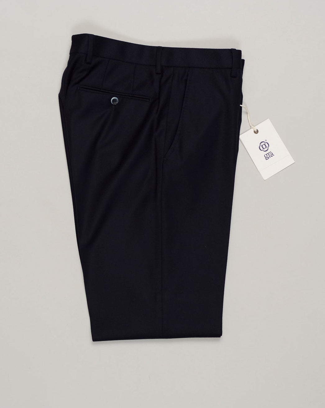 Classic deep navy flannel trousers designed for refined everyday wear. Featuring a patented Comforter waistband for superb comfort and all-day ease. The soft brushed cotton delivers a subtle texture and a reliable drape. Perfect with tailored shirts or casual knitwear, this timeless style transitions seamlessly from the office to the weekend. GTA Moda Flannel Trousers / Navy