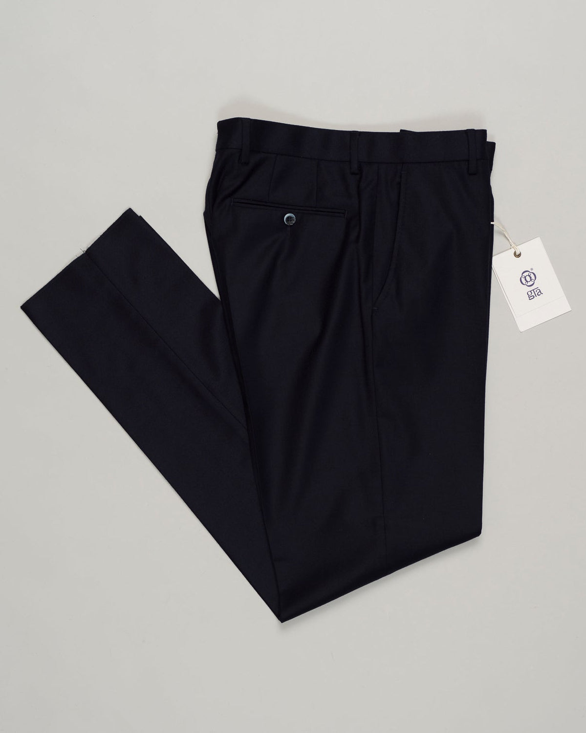 Classic deep navy flannel trousers designed for refined everyday wear. Featuring a patented Comforter waistband for superb comfort and all-day ease. The soft brushed cotton delivers a subtle texture and a reliable drape. Perfect with tailored shirts or casual knitwear, this timeless style transitions seamlessly from the office to the weekend. GTA Moda Flannel Trousers / Navy