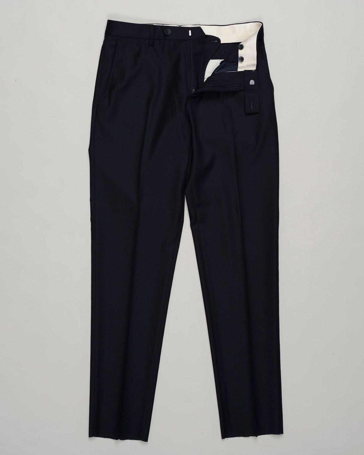 Classic deep navy flannel trousers designed for refined everyday wear. Featuring a patented Comforter waistband for superb comfort and all-day ease. The soft brushed cotton delivers a subtle texture and a reliable drape. Perfect with tailored shirts or casual knitwear, this timeless style transitions seamlessly from the office to the weekend. GTA Moda Flannel Trousers / Navy