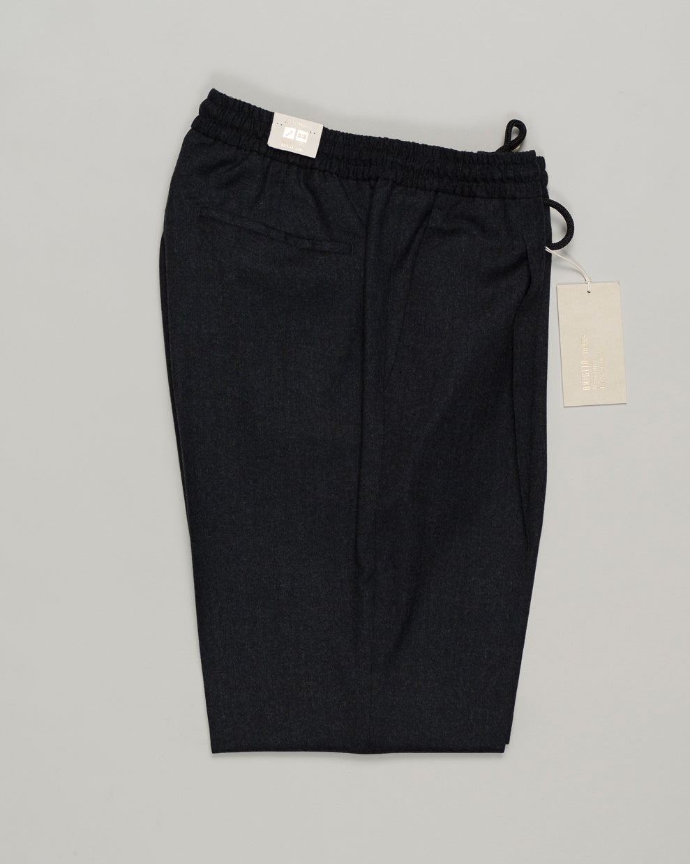 Italian tailoring meets everyday ease. These Briglia drawstring flannels in navy offer a relaxed fit with refined detailing. Soft flannel construction with an adjustable waist ensures comfort without compromise. Briglia Drawstring Flannel Trousers / Navy