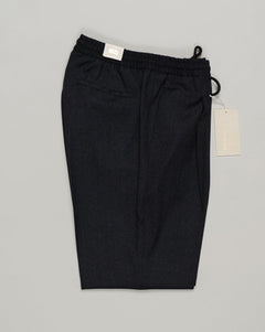 Italian tailoring meets everyday ease. These Briglia drawstring flannels in navy offer a relaxed fit with refined detailing. Soft flannel construction with an adjustable waist ensures comfort without compromise. Briglia Drawstring Flannel Trousers / Navy