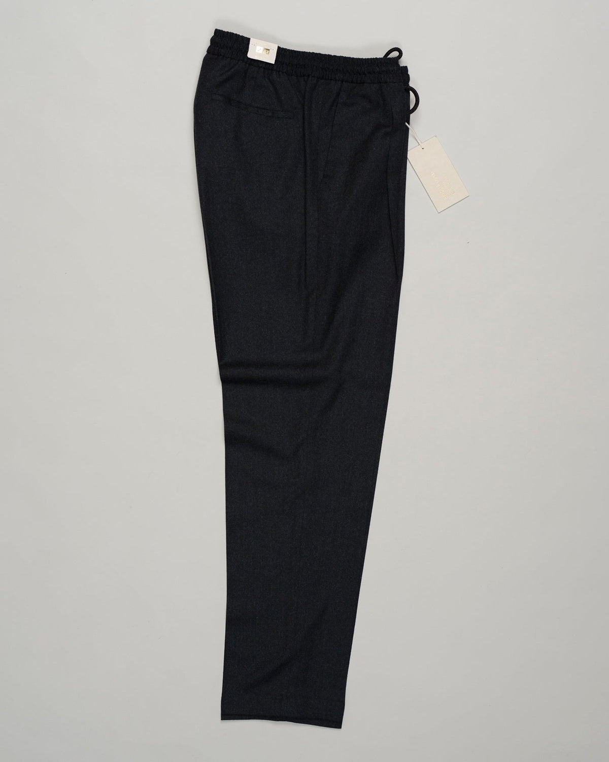 Italian tailoring meets everyday ease. These Briglia drawstring flannels in navy offer a relaxed fit with refined detailing. Soft flannel construction with an adjustable waist ensures comfort without compromise. Briglia Drawstring Flannel Trousers / Navy