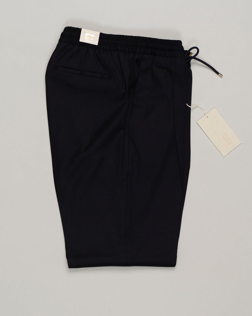 Italian tailoring meets everyday ease. These Briglia drawstring flannels in navy offer a relaxed fit with refined detailing. Soft flannel construction with an adjustable waist ensures comfort without compromise. Briglia Drawstring Flannel Trousers / Navy