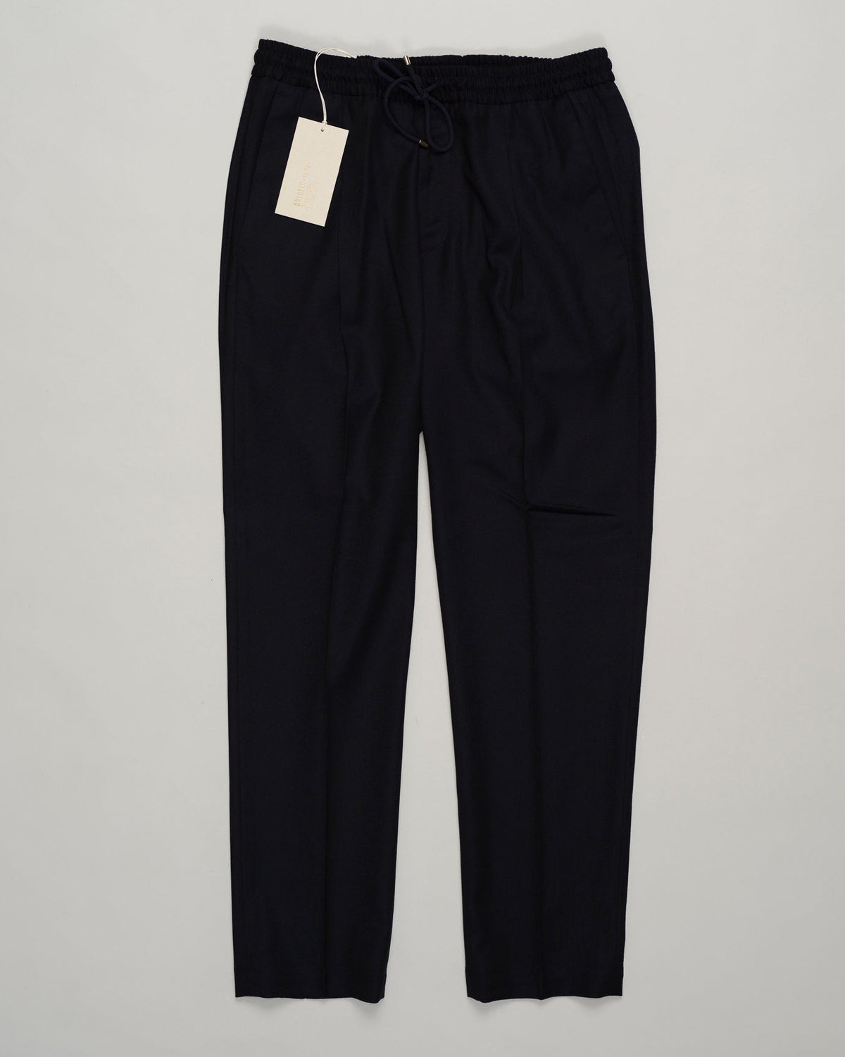 Italian tailoring meets everyday ease. These Briglia drawstring flannels in navy offer a relaxed fit with refined detailing. Soft flannel construction with an adjustable waist ensures comfort without compromise. Briglia Drawstring Flannel Trousers / Navy