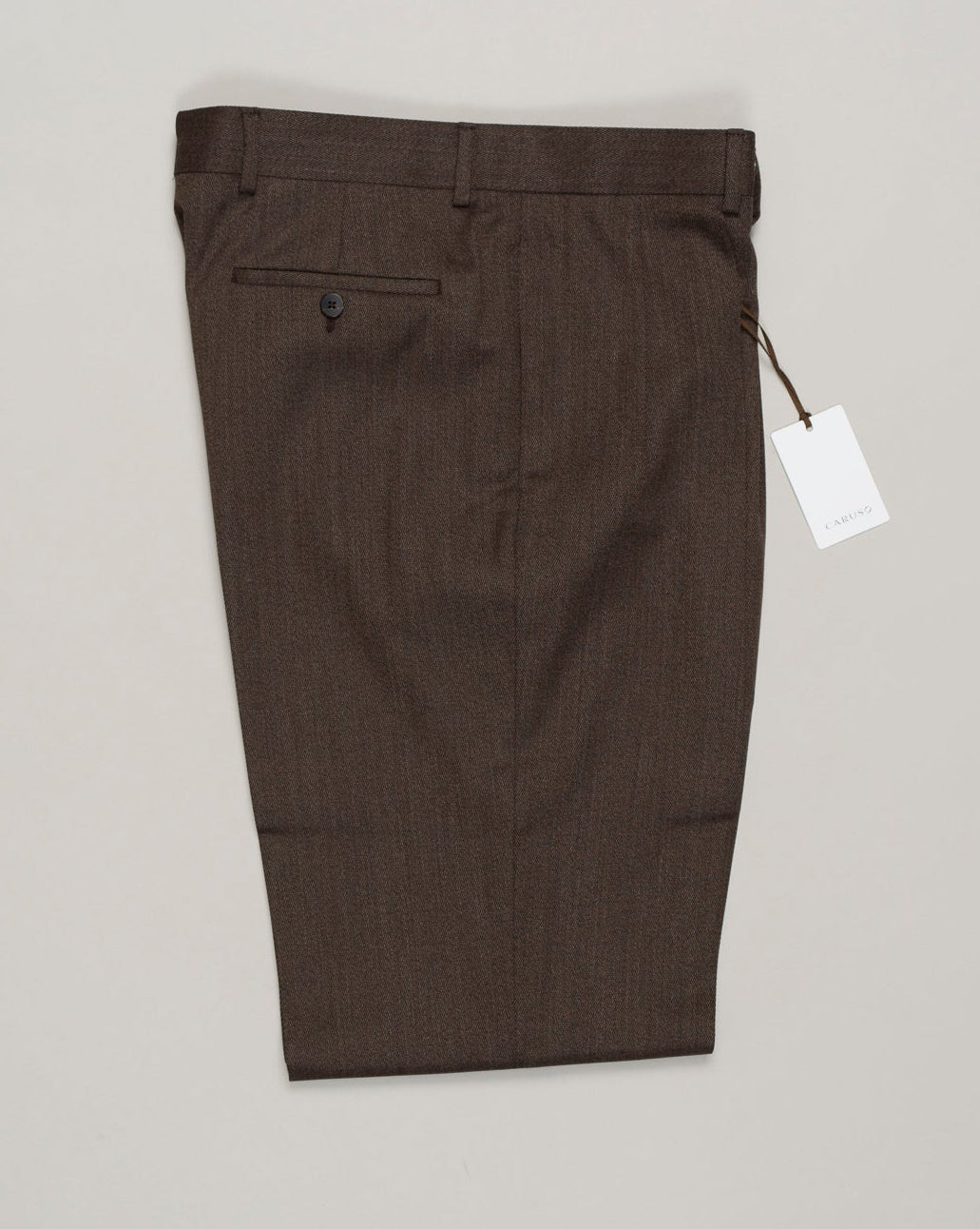 Impeccably tailored pleated trousers in rich brown covert wool. A Caruso signature, cut for refined silhouette and effortless elegance. Premium fabric with subtle texture, designed for versatility across formal and smart-casual occasions. Caruso Pleated Covert Wool Trousers / Brown