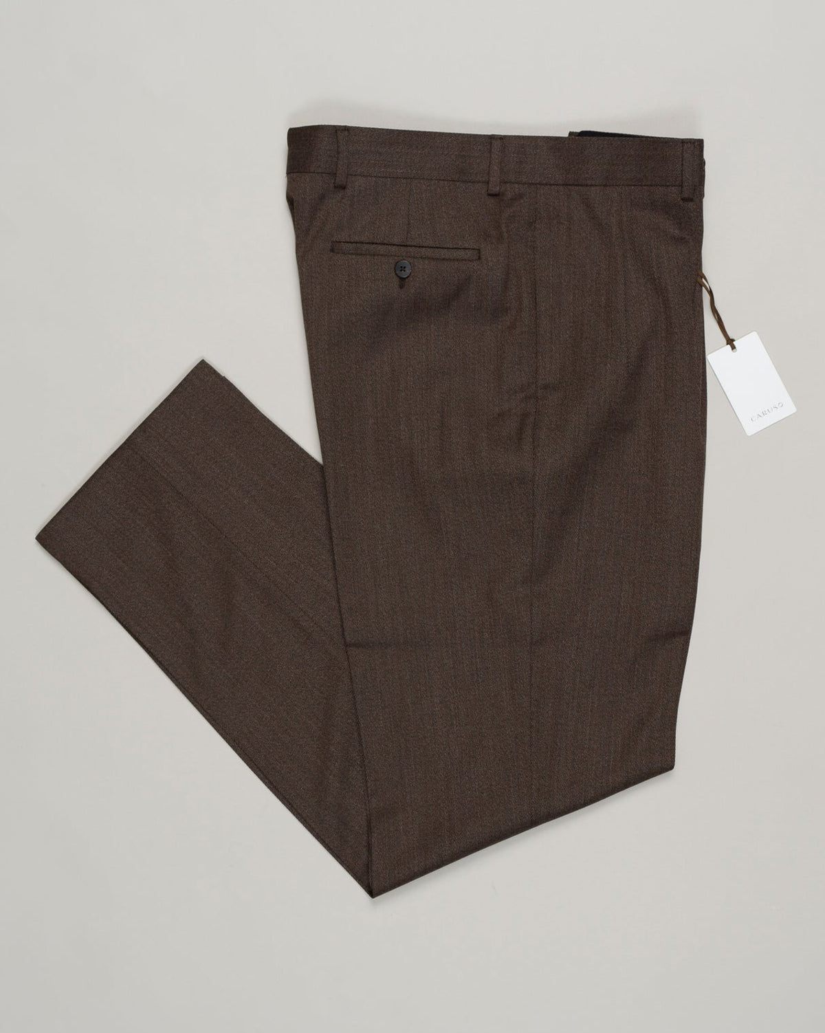 Impeccably tailored pleated trousers in rich brown covert wool. A Caruso signature, cut for refined silhouette and effortless elegance. Premium fabric with subtle texture, designed for versatility across formal and smart-casual occasions. Caruso Pleated Covert Wool Trousers / Brown