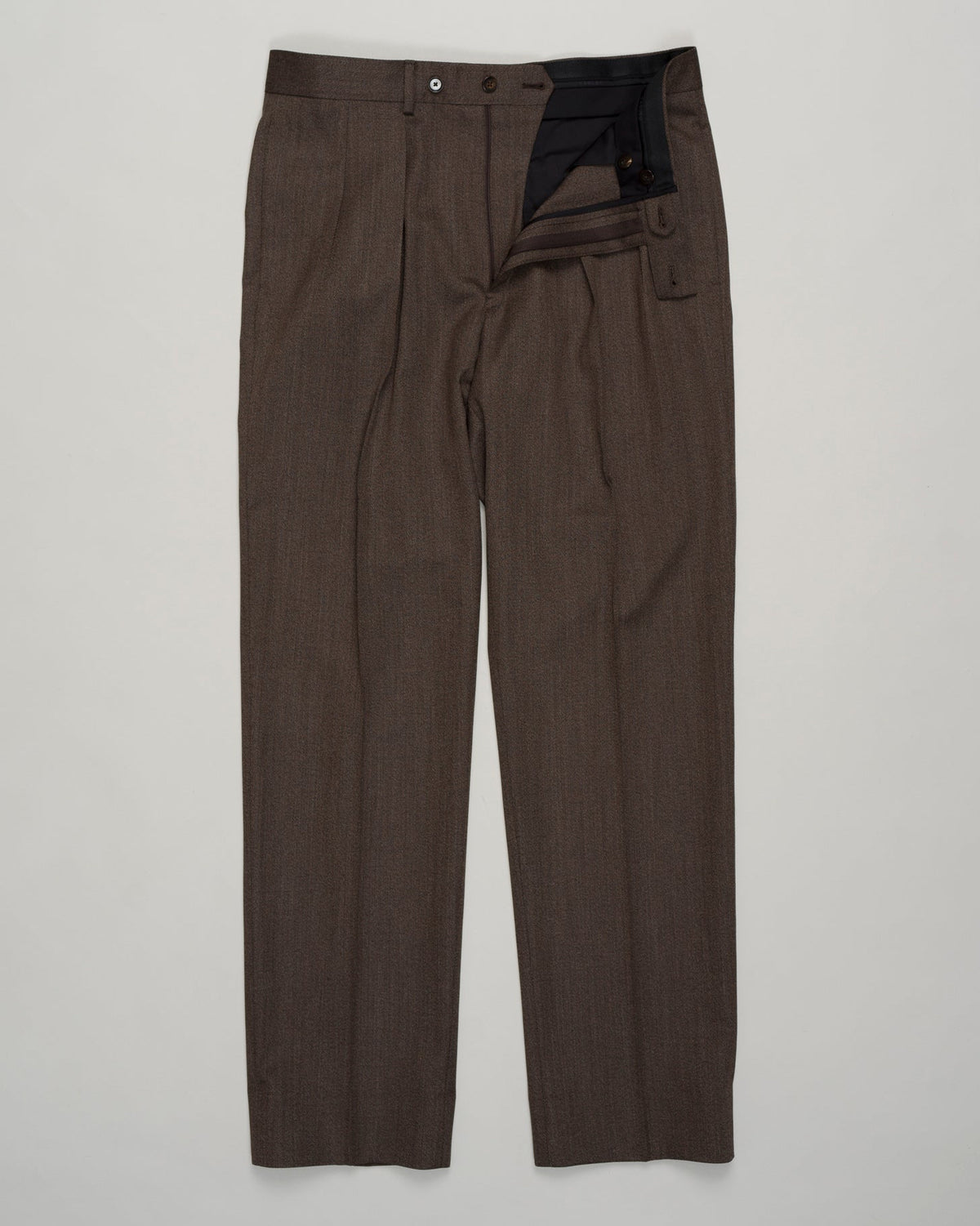 Impeccably tailored pleated trousers in rich brown covert wool. A Caruso signature, cut for refined silhouette and effortless elegance. Premium fabric with subtle texture, designed for versatility across formal and smart-casual occasions. Caruso Pleated Covert Wool Trousers / Brown