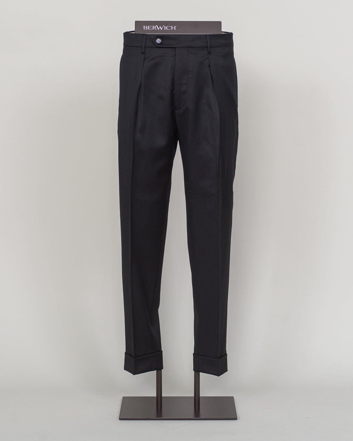 Italian tailoring meets modern comfort in these Berwich Chiaia long trousers. Crafted from a refined wool-stretch blend, they deliver a sharp, structured silhouette with the ease of movement essential for daily wear. The classic black colorway pairs seamlessly with blazers and shirts across seasons. Designed for the discerning man who values both precision fit and practical performance.