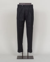 Italian tailoring meets modern comfort in these Berwich Chiaia long trousers. Crafted from a refined wool-stretch blend, they deliver a sharp, structured silhouette with the ease of movement essential for daily wear. The classic black colorway pairs seamlessly with blazers and shirts across seasons. Designed for the discerning man who values both precision fit and practical performance.