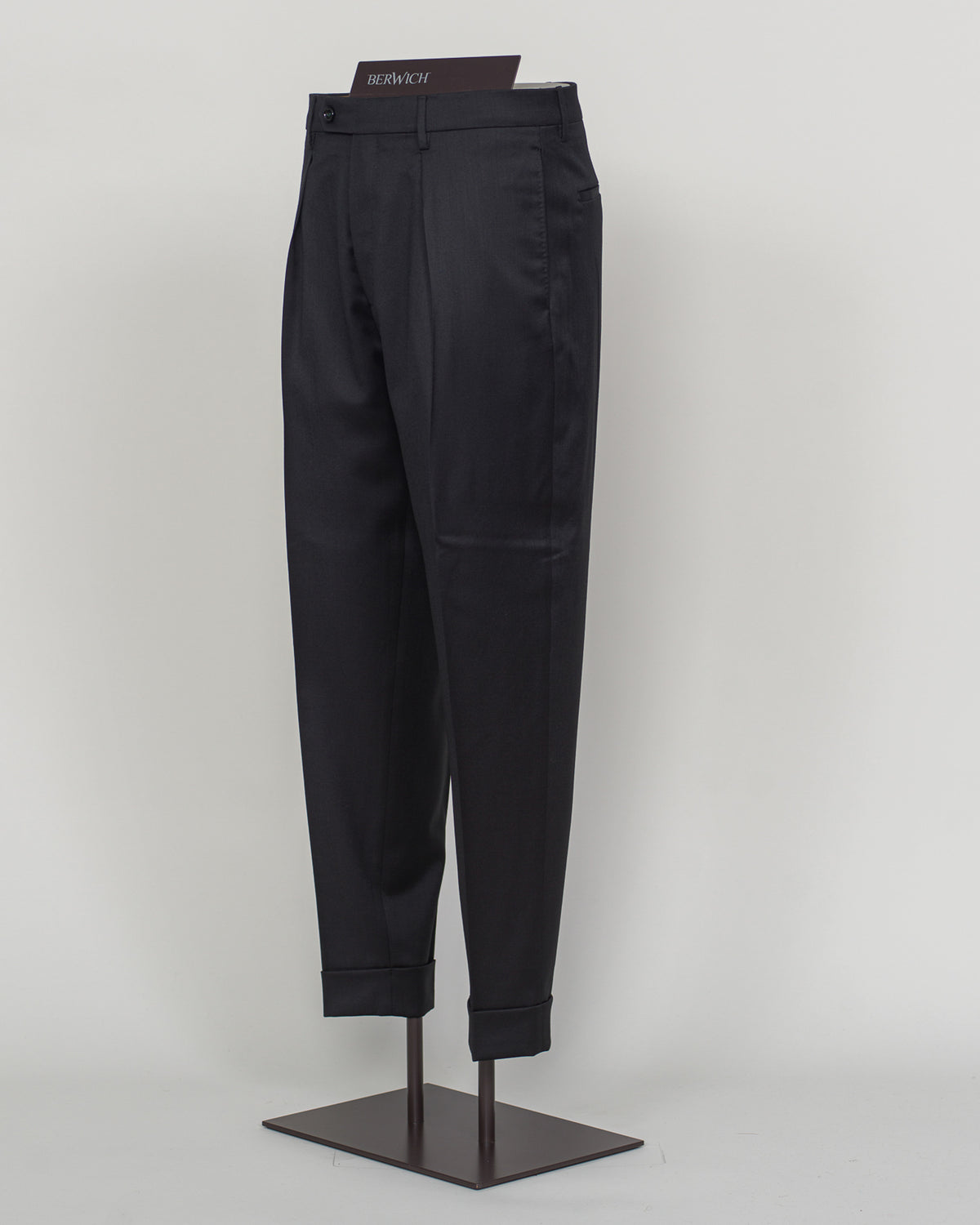 Italian tailoring meets modern comfort in these Berwich Chiaia long trousers. Crafted from a refined wool-stretch blend, they deliver a sharp, structured silhouette with the ease of movement essential for daily wear. The classic black colorway pairs seamlessly with blazers and shirts across seasons. Designed for the discerning man who values both precision fit and practical performance.