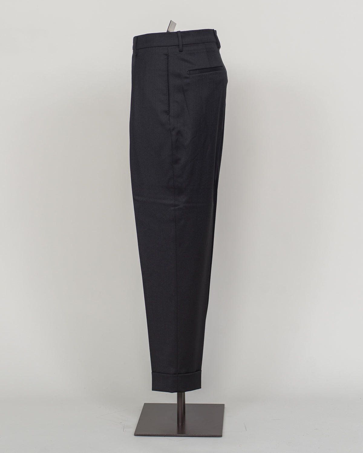 Italian tailoring meets modern comfort in these Berwich Chiaia long trousers. Crafted from a refined wool-stretch blend, they deliver a sharp, structured silhouette with the ease of movement essential for daily wear. The classic black colorway pairs seamlessly with blazers and shirts across seasons. Designed for the discerning man who values both precision fit and practical performance.