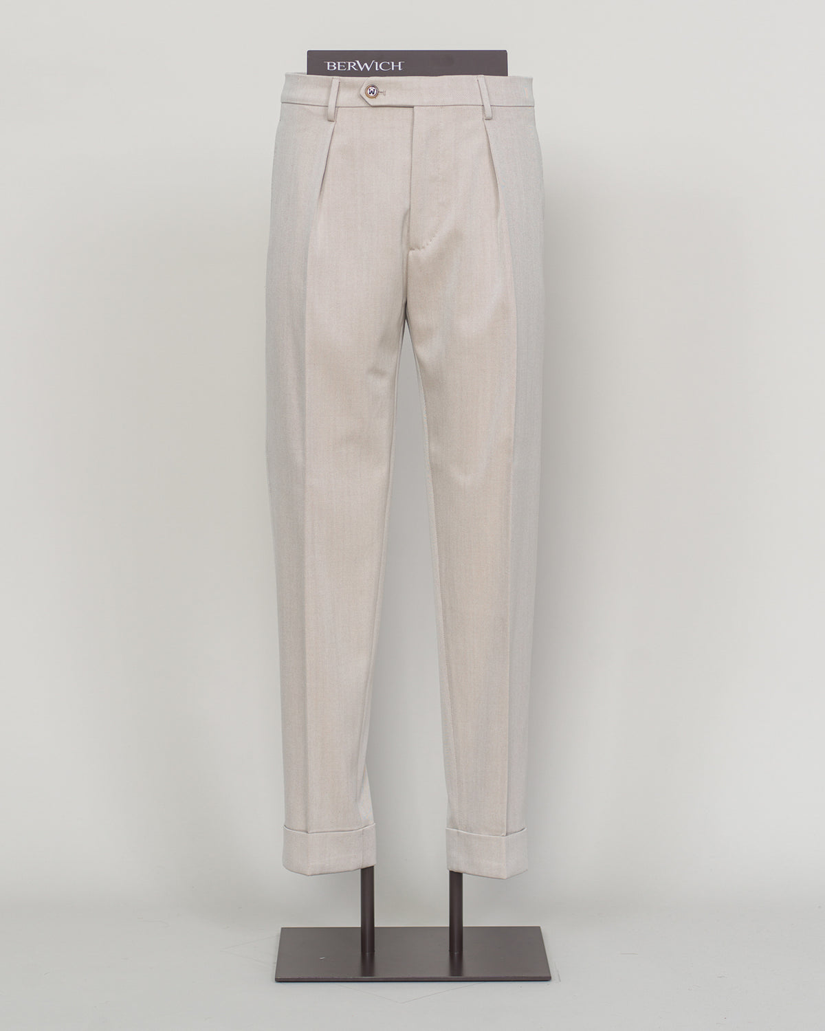 Crafted from a refined blend of wool and cotton, these Berwich trousers exemplify Italian tailoring at its finest. The long-staple gabardine weave delivers a subtle lustre and exceptional drape, while the balanced fibre composition ensures breathability and durability across seasons.

The versatile chalk tone pairs seamlessly with sport coats, knitwear, and tailored jackets. Clean lines and a measured cut reflect contemporary menswear proportions without compromise on classic elegance.

A foundation piece f