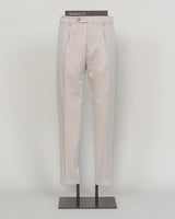 Crafted from a refined blend of wool and cotton, these Berwich trousers exemplify Italian tailoring at its finest. The long-staple gabardine weave delivers a subtle lustre and exceptional drape, while the balanced fibre composition ensures breathability and durability across seasons.

The versatile chalk tone pairs seamlessly with sport coats, knitwear, and tailored jackets. Clean lines and a measured cut reflect contemporary menswear proportions without compromise on classic elegance.

A foundation piece f