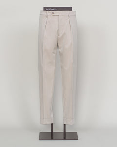Crafted from a refined blend of wool and cotton, these Berwich trousers exemplify Italian tailoring at its finest. The long-staple gabardine weave delivers a subtle lustre and exceptional drape, while the balanced fibre composition ensures breathability and durability across seasons.

The versatile chalk tone pairs seamlessly with sport coats, knitwear, and tailored jackets. Clean lines and a measured cut reflect contemporary menswear proportions without compromise on classic elegance.

A foundation piece f