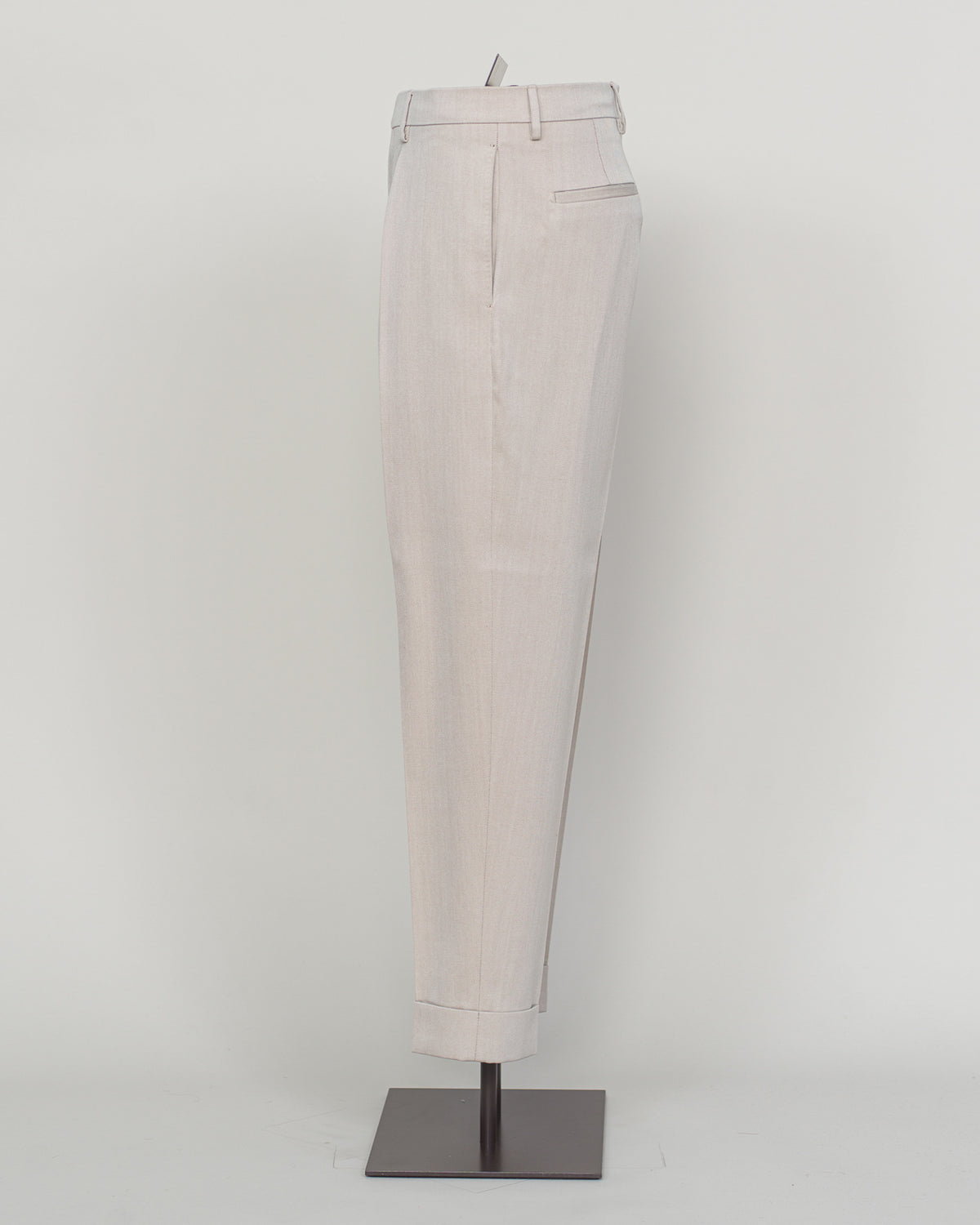 Crafted from a refined blend of wool and cotton, these Berwich trousers exemplify Italian tailoring at its finest. The long-staple gabardine weave delivers a subtle lustre and exceptional drape, while the balanced fibre composition ensures breathability and durability across seasons.

The versatile chalk tone pairs seamlessly with sport coats, knitwear, and tailored jackets. Clean lines and a measured cut reflect contemporary menswear proportions without compromise on classic elegance.

A foundation piece f