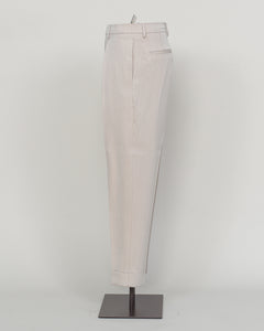 Crafted from a refined blend of wool and cotton, these Berwich trousers exemplify Italian tailoring at its finest. The long-staple gabardine weave delivers a subtle lustre and exceptional drape, while the balanced fibre composition ensures breathability and durability across seasons.

The versatile chalk tone pairs seamlessly with sport coats, knitwear, and tailored jackets. Clean lines and a measured cut reflect contemporary menswear proportions without compromise on classic elegance.

A foundation piece f