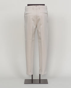 Crafted from a refined blend of wool and cotton, these Berwich trousers exemplify Italian tailoring at its finest. The long-staple gabardine weave delivers a subtle lustre and exceptional drape, while the balanced fibre composition ensures breathability and durability across seasons.

The versatile chalk tone pairs seamlessly with sport coats, knitwear, and tailored jackets. Clean lines and a measured cut reflect contemporary menswear proportions without compromise on classic elegance.

A foundation piece f