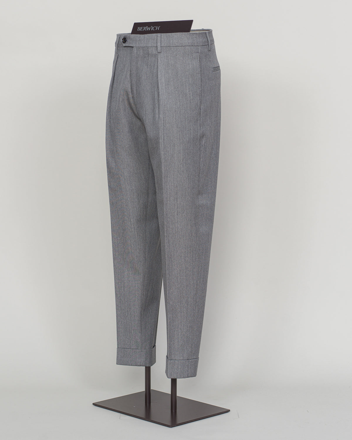 Crafted from a refined blend of wool and cotton, these Berwich trousers exemplify Italian tailoring at its finest. The long-staple gabardine weave delivers a subtle lustre and exceptional drape, while the balanced fibre composition ensures breathability and durability across seasons.

The versatile grey tone pairs seamlessly with sport coats, knitwear, and tailored jackets. Clean lines and a measured cut reflect contemporary menswear proportions without compromise on classic elegance.

A foundation piece fo