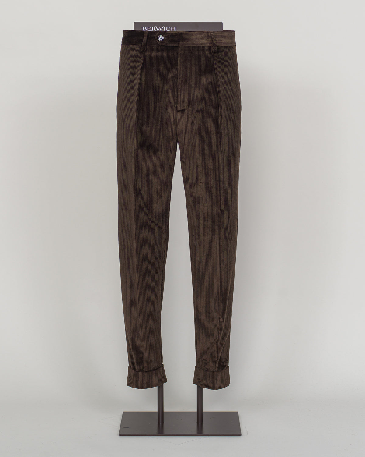 PIC 1 Berwich's Chiaia long trousers exemplify Italian tailoring craftsmanship in a rich brown corduroy. The substantial fabric drapes with refined structure, offering both comfort and presence through seasons of wear. A classic silhouette built for the discerning wardrobe—versatile enough for business and relaxed enough for weekend elegance. Corduroy's textural depth pairs effortlessly with knitwear and structured blazers alike. Berwich Chiaia Long Corduroy Trousers / Brown