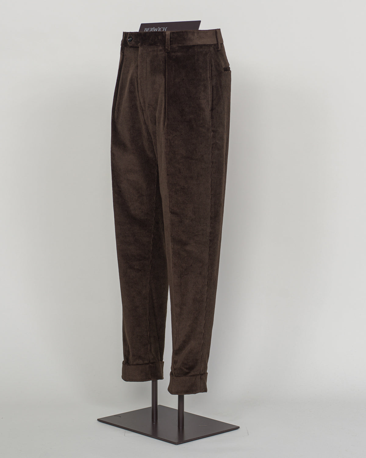 pic 2 Berwich's Chiaia long trousers exemplify Italian tailoring craftsmanship in a rich brown corduroy. The substantial fabric drapes with refined structure, offering both comfort and presence through seasons of wear. A classic silhouette built for the discerning wardrobe—versatile enough for business and relaxed enough for weekend elegance. Corduroy's textural depth pairs effortlessly with knitwear and structured blazers alike. Berwich Chiaia Long Corduroy Trousers / Brown