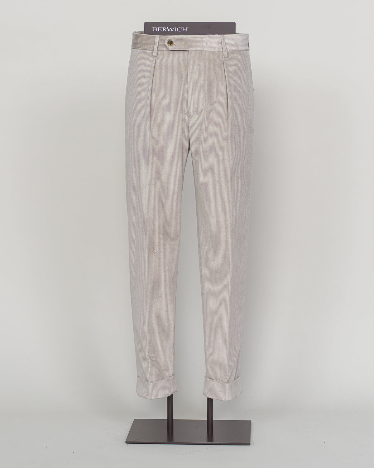 PIC 1 Berwich's Chiaia long trousers exemplify Italian tailoring craftsmanship in a light grey corduroy. The substantial fabric drapes with refined structure, offering both comfort and presence through seasons of wear. A classic silhouette built for the discerning wardrobe—versatile enough for business and relaxed enough for weekend elegance. Corduroy's textural depth pairs effortlessly with knitwear and structured blazers alike. Berwich Chiaia Long Corduroy Trousers / Light Grey