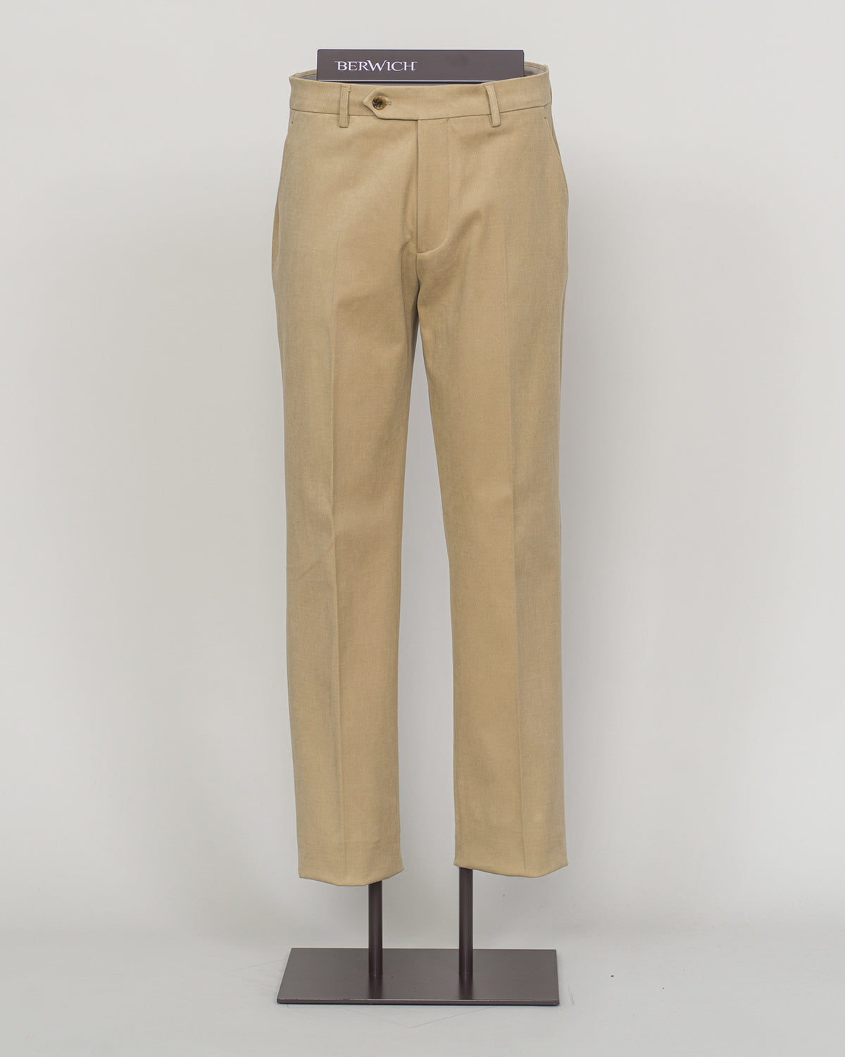 Berwich brushed cotton chinos deliver understated elegance and effortless versatility. The soft, matte finish of premium brushed cotton creates a refined texture that moves naturally, while the classic beige tone pairs seamlessly with neutral and jewel tones alike.

Cut for a modern fit with a tapered leg, these chinos offer comfort without compromise. The quality construction and timeless design make them a wardrobe essential—equally at home in the office or paired with a simple knit for weekend ease.