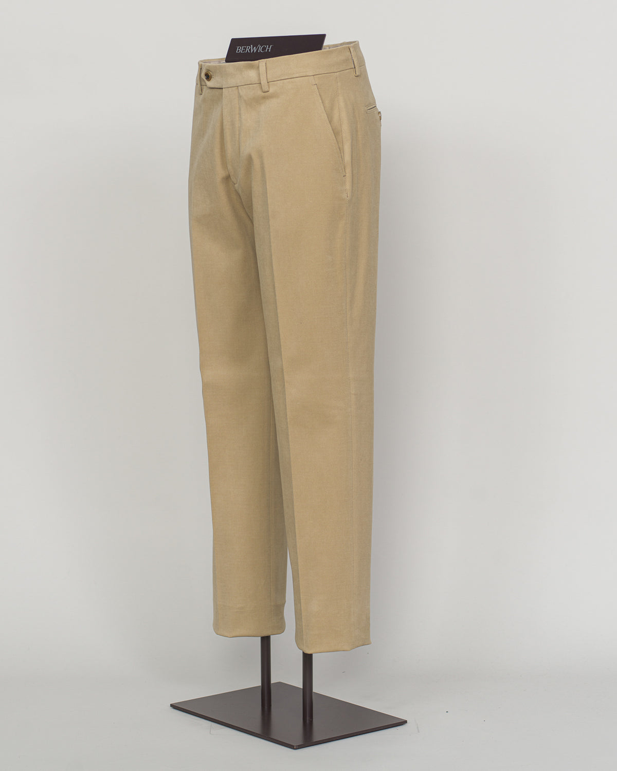 Berwich brushed cotton chinos deliver understated elegance and effortless versatility. The soft, matte finish of premium brushed cotton creates a refined texture that moves naturally, while the classic beige tone pairs seamlessly with neutral and jewel tones alike.

Cut for a modern fit with a tapered leg, these chinos offer comfort without compromise. The quality construction and timeless design make them a wardrobe essential—equally at home in the office or paired with a simple knit for weekend ease.