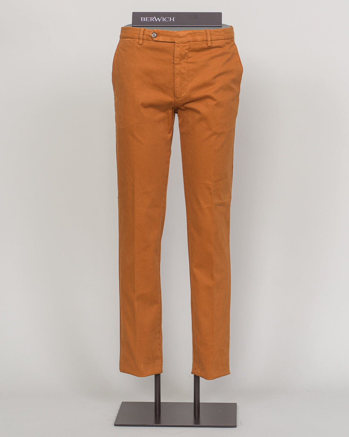 Berwich's Vulcano chinos exemplify Italian craftsmanship with their garment-dyed arancio hue, delivering depth and character that evolves with wear. Cut in a refined, contemporary fit, these chinos balance structure with comfort—ideal for refined casual dressing and smart-casual occasions. The garment-dye process ensures each pair develops its own patina, making them a versatile investment piece for a discerning wardrobe. Pair with lightweight knitwear or classic shirting for effortless sophistication. Berw
