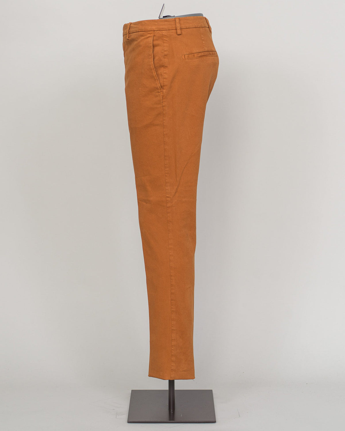 Berwich's Vulcano chinos exemplify Italian craftsmanship with their garment-dyed arancio hue, delivering depth and character that evolves with wear. Cut in a refined, contemporary fit, these chinos balance structure with comfort—ideal for refined casual dressing and smart-casual occasions. The garment-dye process ensures each pair develops its own patina, making them a versatile investment piece for a discerning wardrobe. Pair with lightweight knitwear or classic shirting for effortless sophistication. Berw
