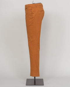 Berwich's Vulcano chinos exemplify Italian craftsmanship with their garment-dyed arancio hue, delivering depth and character that evolves with wear. Cut in a refined, contemporary fit, these chinos balance structure with comfort—ideal for refined casual dressing and smart-casual occasions. The garment-dye process ensures each pair develops its own patina, making them a versatile investment piece for a discerning wardrobe. Pair with lightweight knitwear or classic shirting for effortless sophistication. Berw