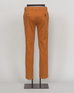 Berwich's Vulcano chinos exemplify Italian craftsmanship with their garment-dyed arancio hue, delivering depth and character that evolves with wear. Cut in a refined, contemporary fit, these chinos balance structure with comfort—ideal for refined casual dressing and smart-casual occasions. The garment-dye process ensures each pair develops its own patina, making them a versatile investment piece for a discerning wardrobe. Pair with lightweight knitwear or classic shirting for effortless sophistication. Berw