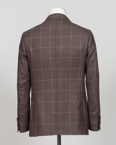 Crafted in Naples by Luigi Borrelli, this windowpane sport jacket exemplifies Italian tailoring precision. The structured brown pattern delivers versatile sophistication—pair it with charcoal trousers for boardroom presence or lighter separates for weekend elegance. Classic cut accommodates layering while maintaining a refined silhouette. A cornerstone piece for discerning menswear collections.