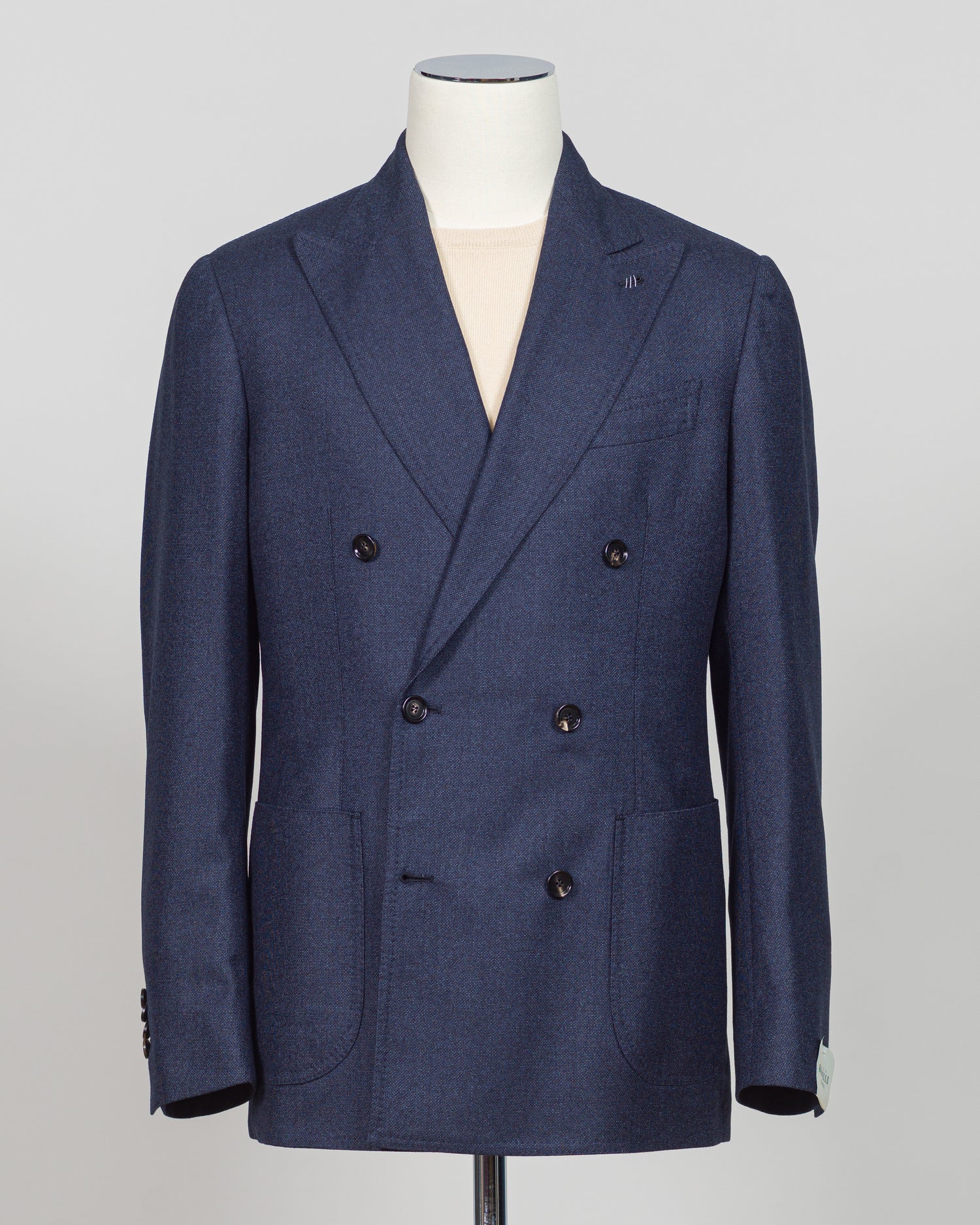 Crafted by Luigi Borrelli, this double breasted blazer in dark blue exemplifies Italian tailoring excellence. The structured silhouette and refined details showcase the brand's mastery of classic menswear construction. Ideal for elevating both business and sophisticated casual wardrobes, this piece pairs seamlessly with dress trousers, chinos, or tailored denim. The versatile dark blue tone ensures year round styling flexibility and enduring relevance in any discerning gentleman's collection.

Perfect for c