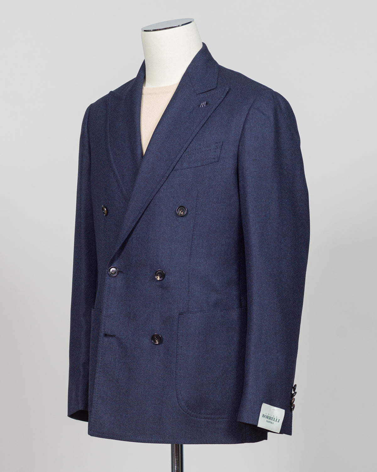 Crafted by Luigi Borrelli, this double breasted blazer in dark blue exemplifies Italian tailoring excellence. The structured silhouette and refined details showcase the brand's mastery of classic menswear construction. Ideal for elevating both business and sophisticated casual wardrobes, this piece pairs seamlessly with dress trousers, chinos, or tailored denim. The versatile dark blue tone ensures year round styling flexibility and enduring relevance in any discerning gentleman's collection.

Perfect for c