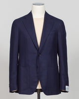 Caruso flannel sport jacket crafted in navy wool with tailored precision. This versatile layer features refined construction detailing and a structured silhouette designed for sophisticated menswear styling. Soft woolen fabric offers warmth and texture while maintaining a polished appearance, making it an essential piece for layering across seasons. Ideal for both professional and casual refined occasions, this jacket pairs seamlessly with dress trousers, chinos, or tailored separates. The classic navy tone